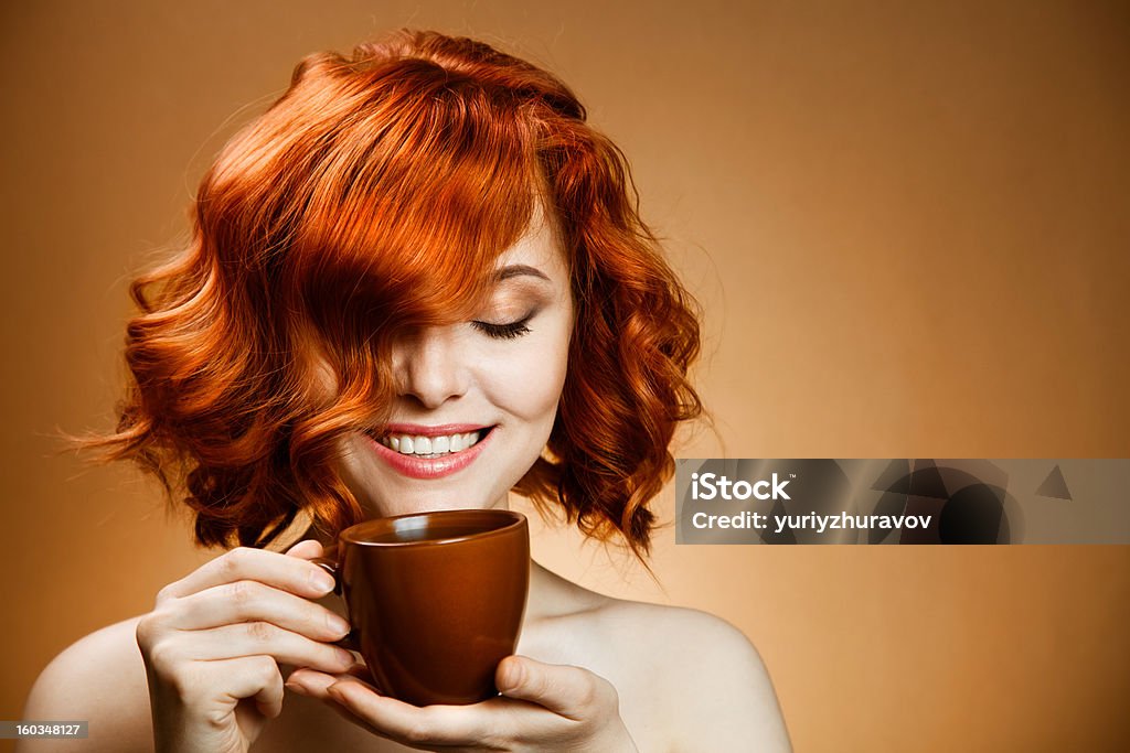 Stylish woman with an aromatic coffee in hands Adult Stock Photo