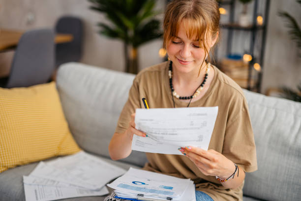 istock Young Woman Checking Her Finances At Home 1603488693