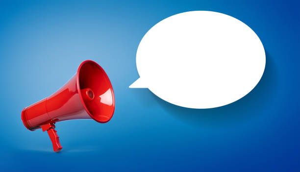 istock Red megaphone with blank white speech bubble on blue background 1603491409