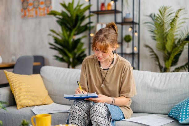istock Young Woman Checking Her Finances At Home 1603497025