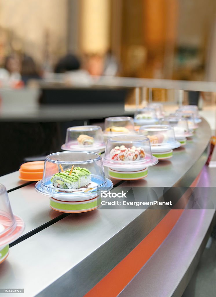 Sushi on conveyor Conveyor belt sushi restaurant in USA Sushi Stock Photo