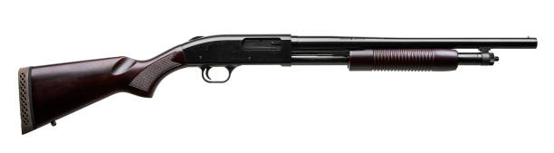 istock Pump-action 12 gauge shotgun isolated on a white background. A smooth-bore weapon with a wooden stock. 1603512366