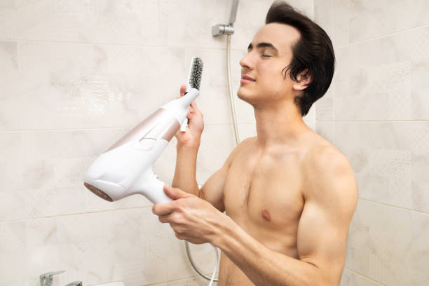 istock Blow drying in the shower 1603522446