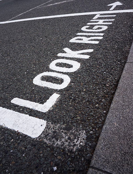 istock Warning message "Look Right" on footpath crossing street 160353867