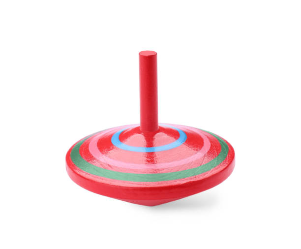 istock One bright spinning top isolated on white. Toy whirligig 1603550610