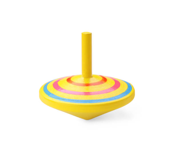 istock One bright spinning top isolated on white. Toy whirligig 1603550612