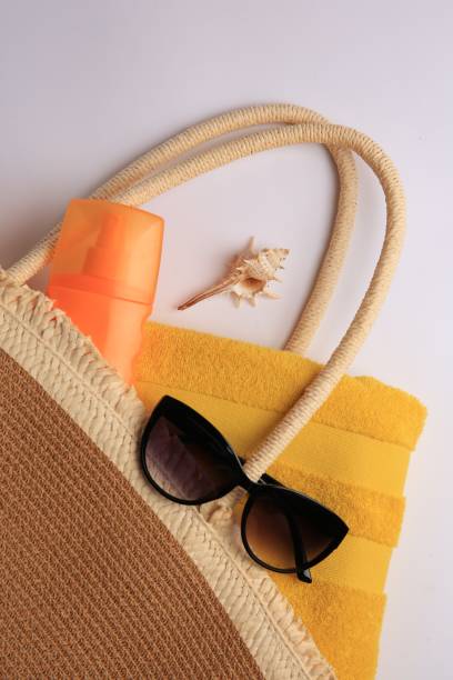 istock Flat lay composition with sunscreen and beach accessories on white background 1603550632
