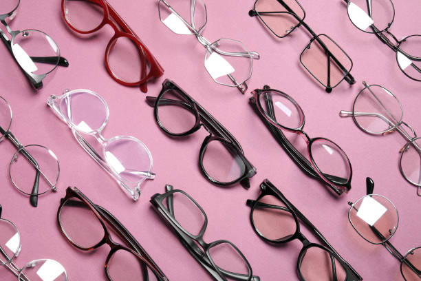 istock Different stylish glasses on pink background, flat lay 1603552826