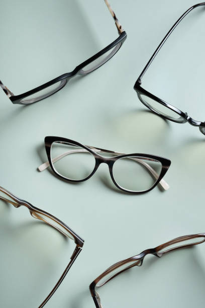 istock Stylish eyeglasses on colored background. Optical store, vision test, stylish glasses concept. 1603556385