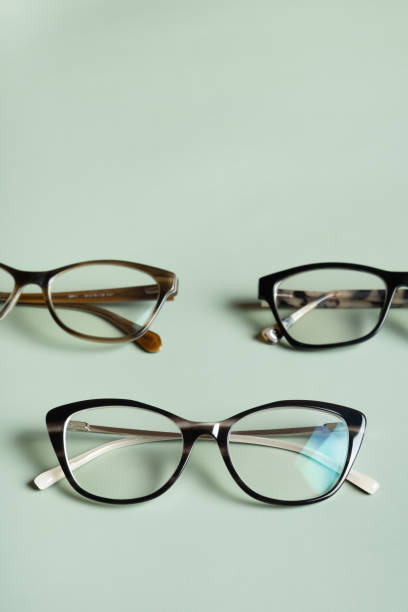 istock Stylish eyeglasses on colored background. Optical store, vision test, stylish glasses concept. 1603556594