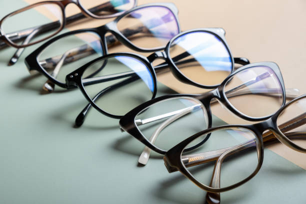 istock Stylish eyeglasses on colored background. Optical store, vision test, stylish glasses concept. 1603556622