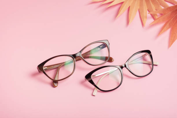 istock Eyeglasses on pink background. Optical store, vision test, stylish glasses concept 1603557160