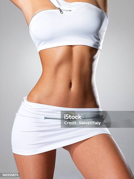 Beautiful Female Slim Tanned Body Stock Photo - Download Image Now - The Human Body, Women, One Woman Only