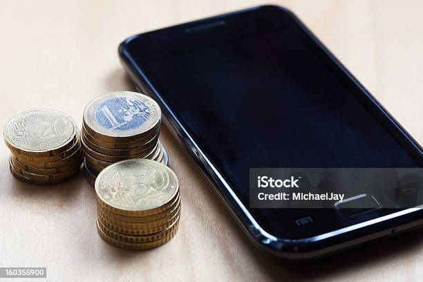 Euro 50 Cent And 20 Ct Coins With Cell Phone Stock Photo - Download Image Now - Blank, Business, Coin