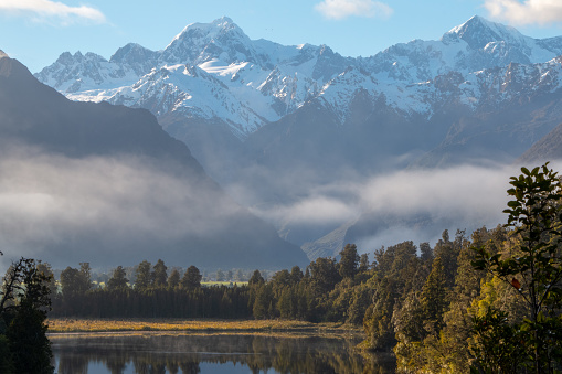 Mount Tasman (Horokoau) and Mount Cook (Aoraki) reflected in Lake Matheson near Fox Glacier in the Southern Alps of New Zealand