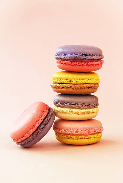 Stack of Pretty Purple, Pink, and Yellow Macarons stock photo
