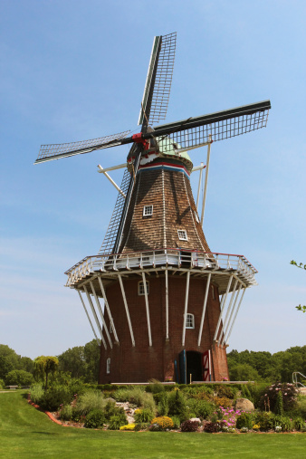 A vertical image of a working Dutch windmill in Holland, Michigan.