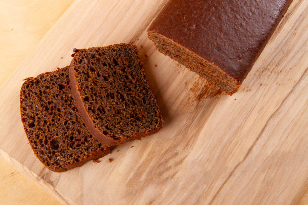 istock Black bread on wooden background 1603657947