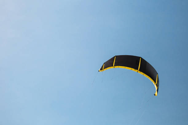 istock Black kite sail in the blue sky 1603661500