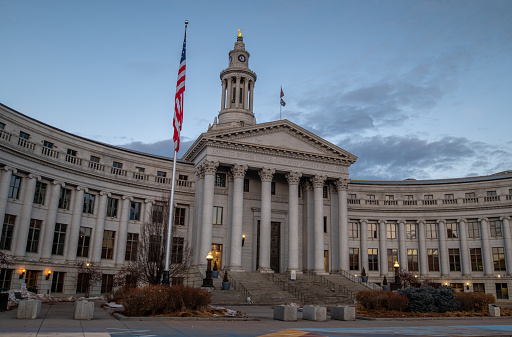 Denver, Colorado - February 12 2023: A view of the City Courthouse from Civic Center Park in the quiet moments of a Sunday morning before the city wakes up.