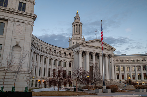 Denver, Colorado - February 12 2023: A view of the City Courthouse from Civic Center Park in the quiet moments of a mid-winter Sunday morning before the city wakes up.