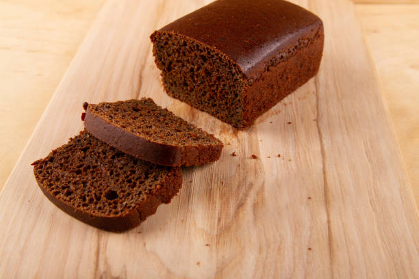 istock Black bread on wooden background 1603666740