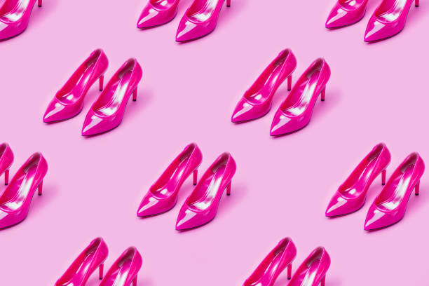 Close-Up Of Shoes Against Beige Background