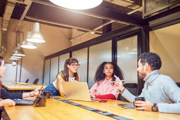 istock multiracial group of young students or employees sitting in co-working space interacting 1603673164
