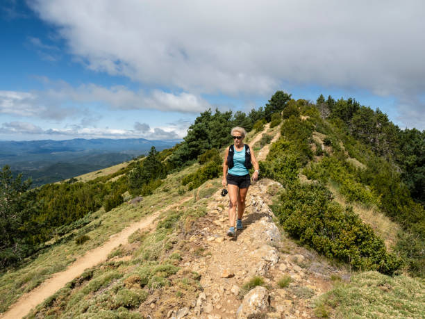 istock Woman doing sport in the mountains 1603690452
