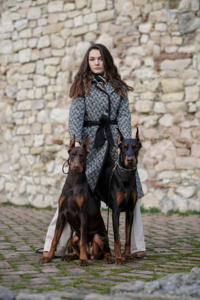 istock Girl with dogs 1603702478