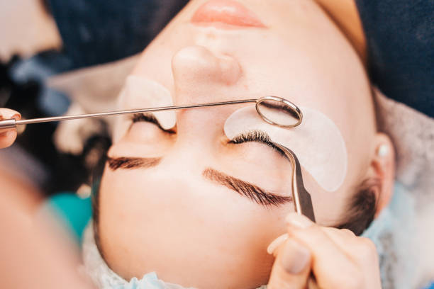 istock Cosmetic procedure for the extension of artificial eyelashes 1603704067