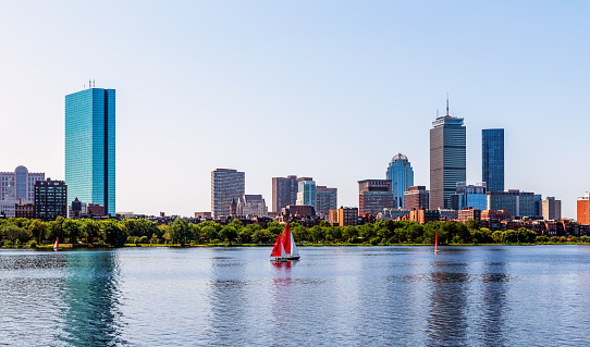 Boston Back Bay skyline and the Charles River with sailboats.