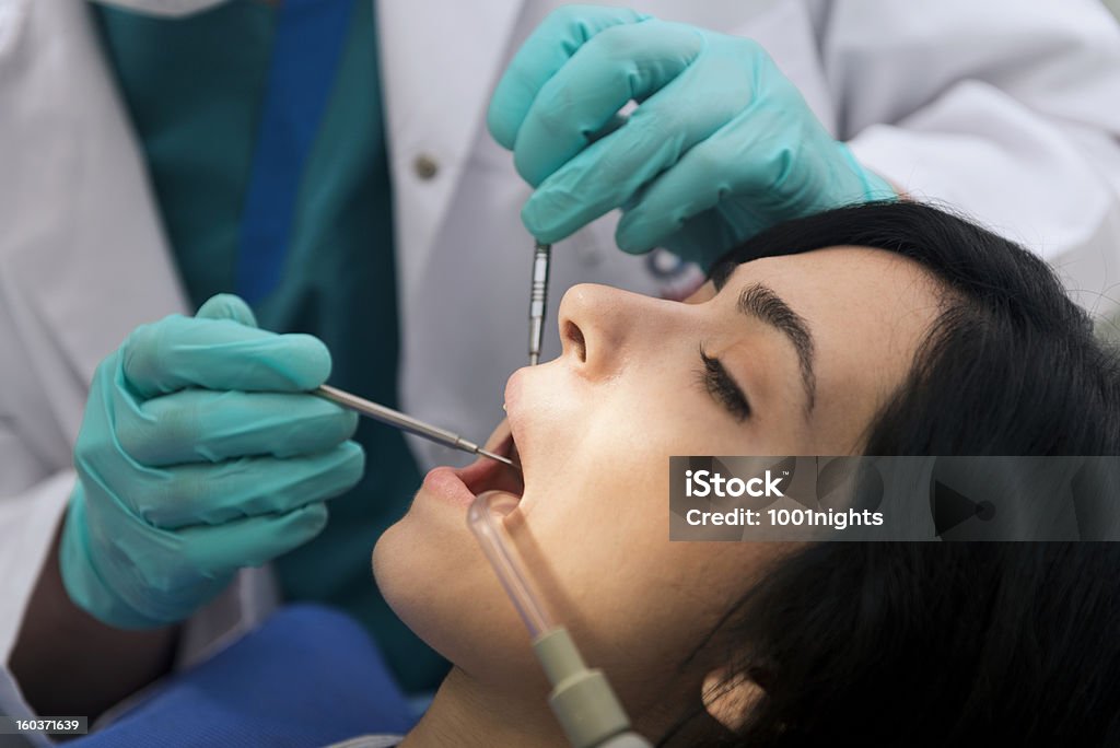 Dentist at work. Dentist Stock Photo