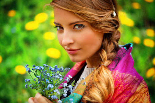 girl holding a bouquet of wild flowers