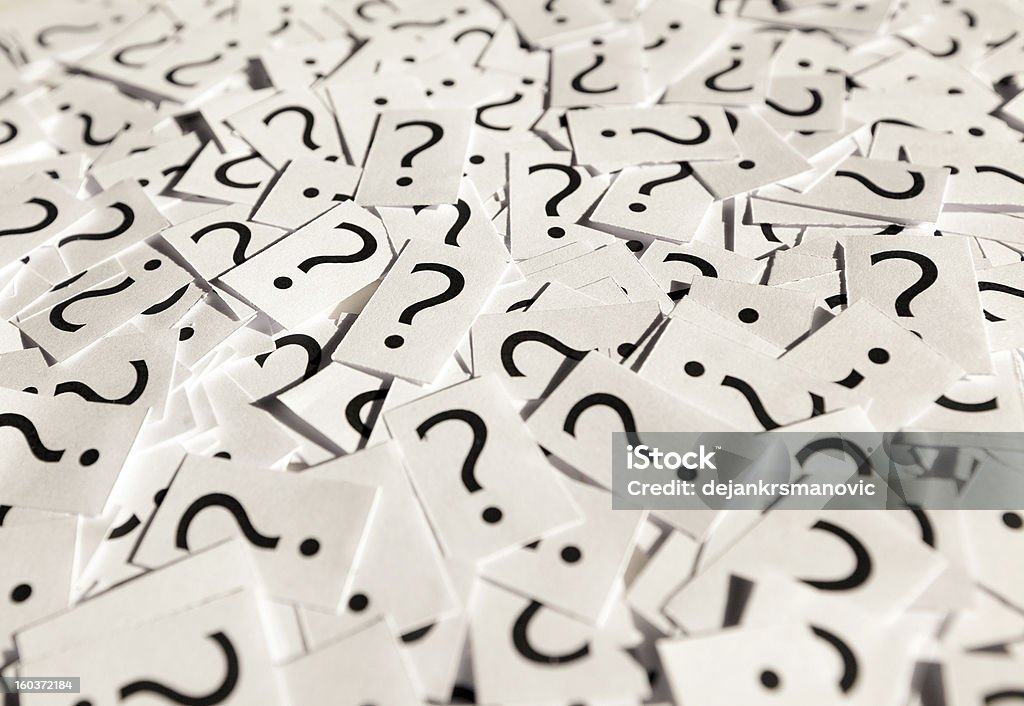 Questions Just a lot of question marks on white papers. Asking Stock Photo