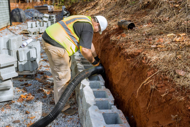 istock Construction engineer are laying a drainage pipe for rainwater in retaining wall. 1603728337