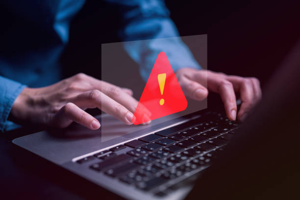 istock People with warning notification and spam message icon on laptop. 1603739909