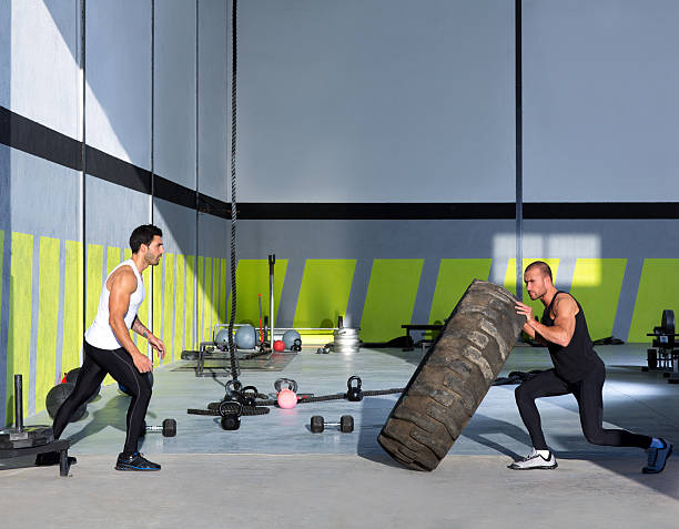 istock gym flip tires men flipping each other 160374352