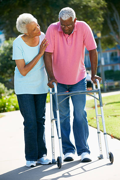 istock Senior Woman Helping Husband With Walking Frame 160374374