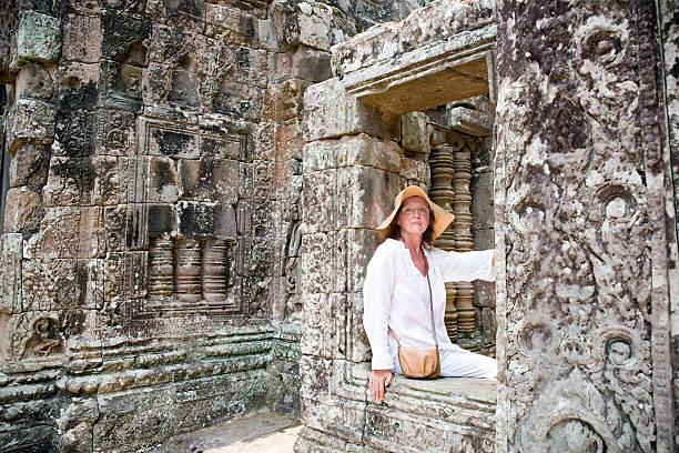 istock Woman in Bayon temple Angkor 160374752