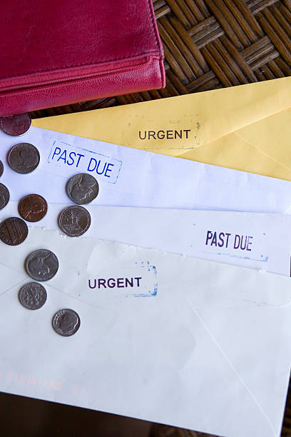 istock Unpaid Bills on Table with Currency and Wallet 160374761