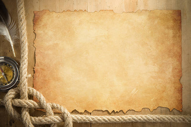 istock ship ropes and compass at parchment old paper 160375169