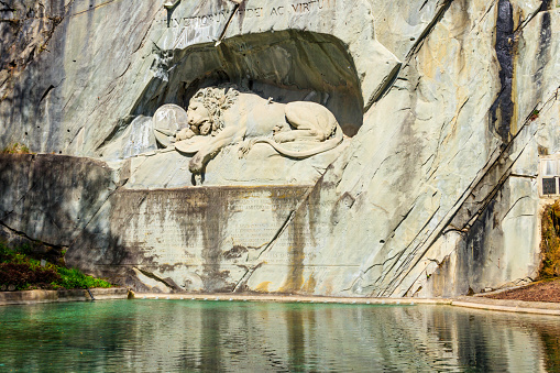 Lucerne, Switzerland - April 13, 2022: Lion Monument or the Lion of Lucerne, is a rock relief in Lucerne, Switzerland