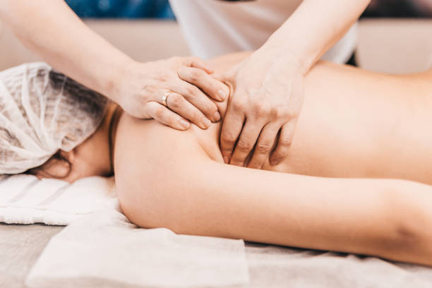 istock Professional face, back and legs massage in the massage parlor 1603761134
