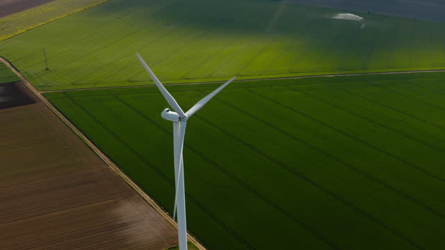 AERIAL : Wind Turbine Farm at Sunset. Aerial view of Windmill Alternative energy , Wind turbine