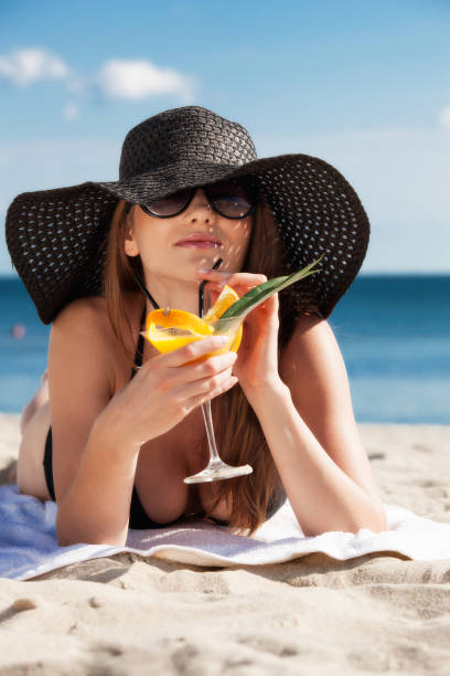 istock Beautiful girl lying on the beach 160376493