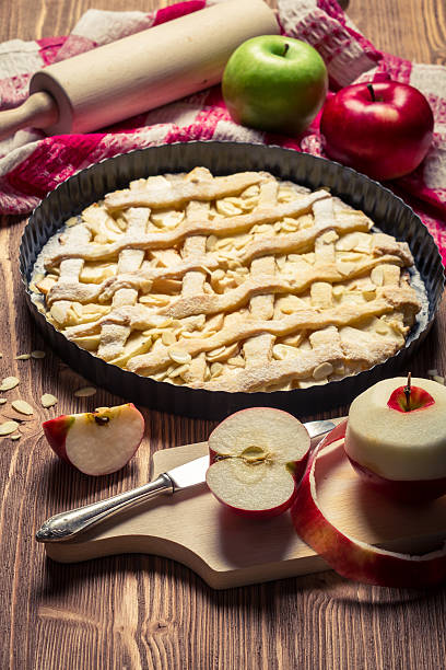 istock Apple pie with fresh fruits on old brown table 160378010