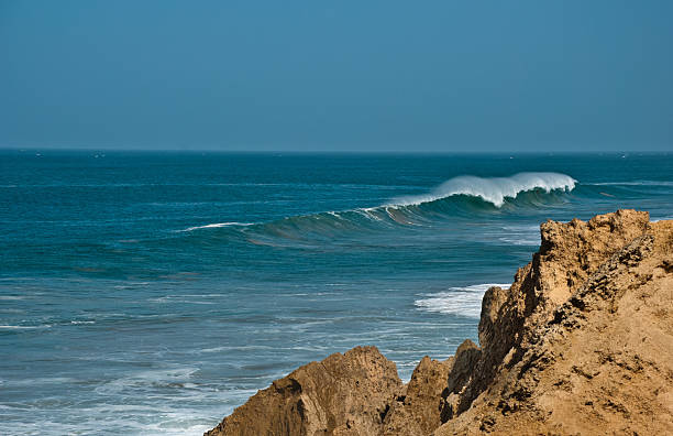 Breaking Wave near a cliff in Marocco stock photo