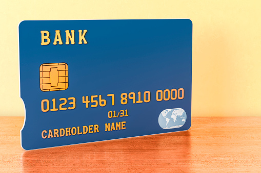 3D Credit card concept: Red color plastic credit card illustration. Front view mockup template design on white background, large copy space. Online shopping payment, mobile banking and touchfree transaction. Mobile wallet with contactless symbol.