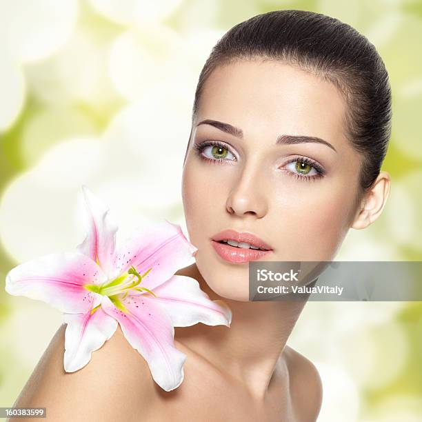 Beauty Face Of Young Woman With Flower Stock Photo - Download Image Now - Adult, Adults Only, Art